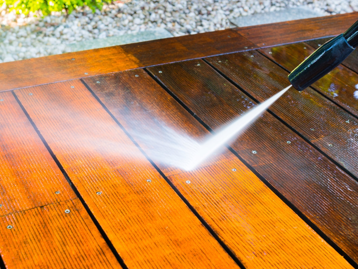 Backyard deck and fence restored to original beauty with specialized cleaning techniques, emphasizing clean wood textures and enhanced color.