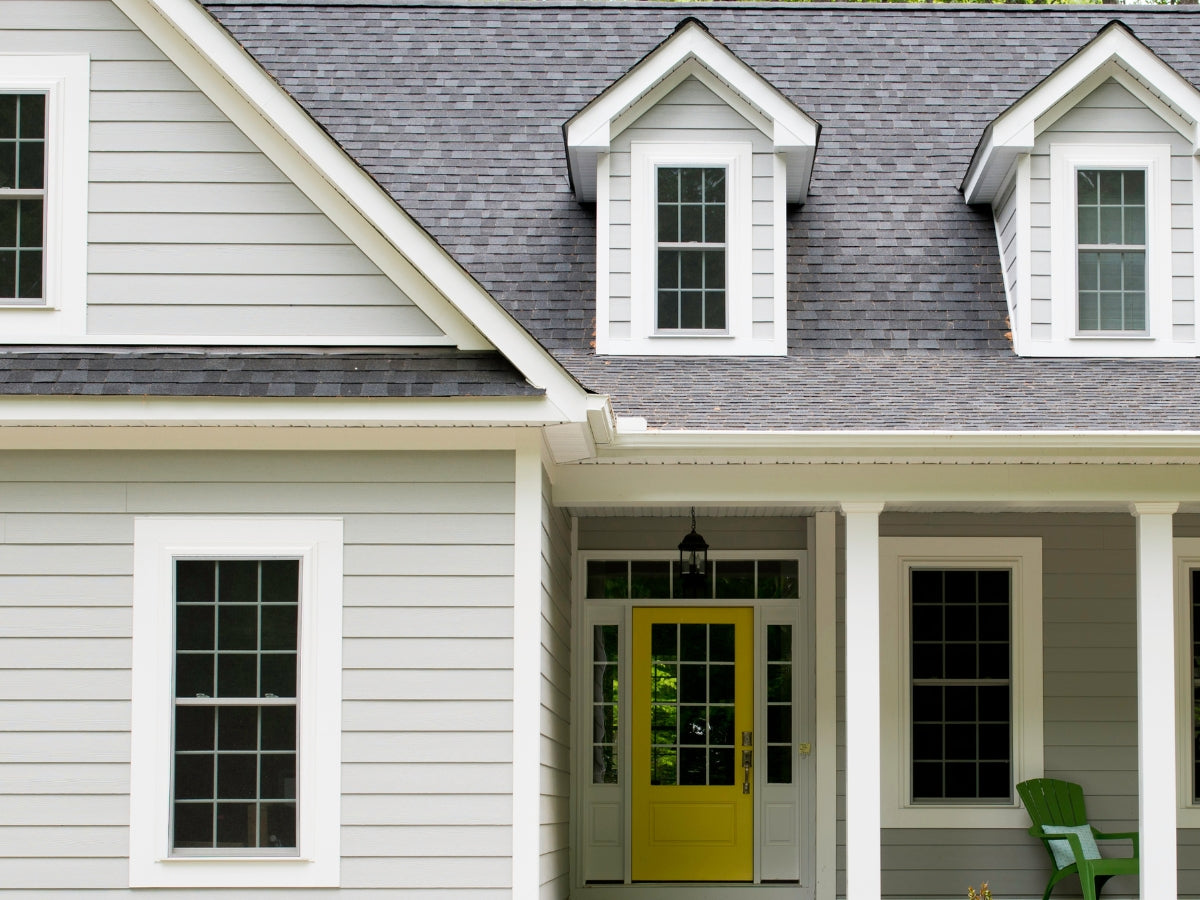 Images of a home exterior dramatically improved by professional cleaning services, showcasing pristine curb appeal.